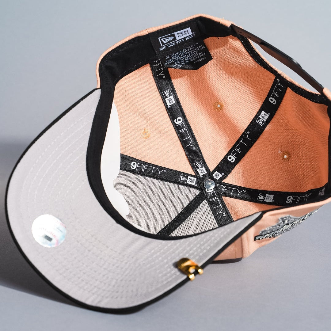 NEW ERA 9FIFTY A-FRAME BLUSH/BLACK TEXAS RANGERS SNAPBACK W/ WORLD SERIES CHAMPIONS SIDE PATCH