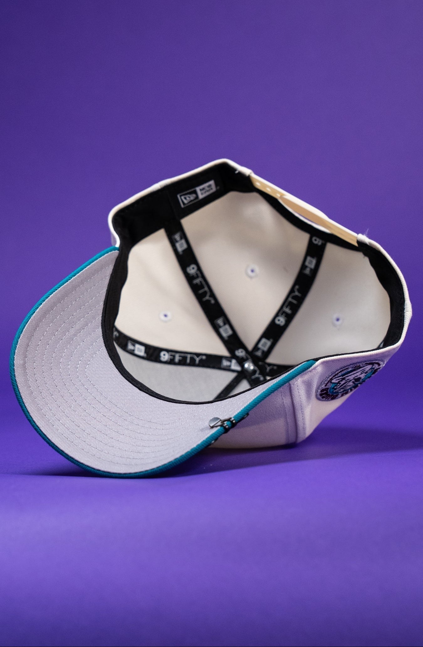 NEW ERA 9FIFTY A-FRAME CHROME/TURQUOISE ANAHEIM DUCKS SNAPBACK W/ "DUCKS" SIDE PATCH