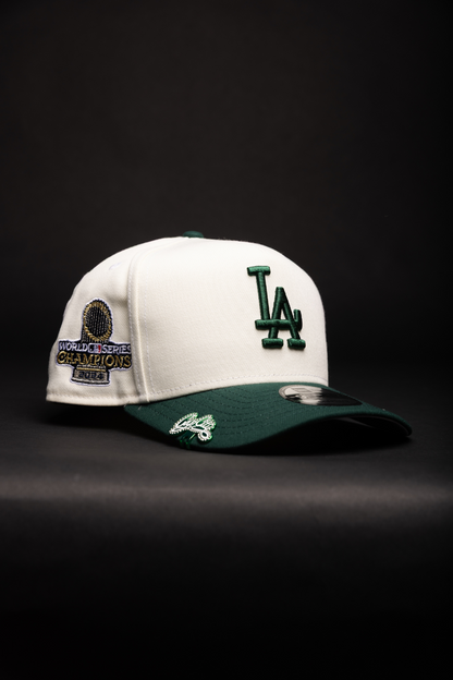 NEW ERA 9FIFTY A-FRAME CHROME/FOREST GREEN LOS ANGELES DODGERS SNAPBACK W/ WORLD SERIES CHAMPIONS SIDE PATCH