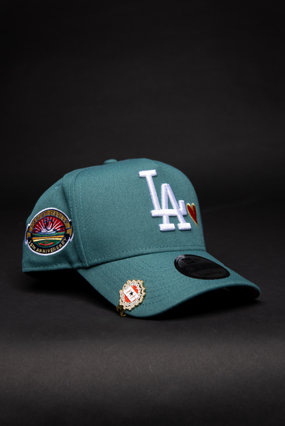 NEW ERA 9FIFTY A-FRAME PINE GREEN LOS ANGELES DODGERS SNAPBACK W/ RED HEART + 50TH ANNIVERSARY SIDE PATCH