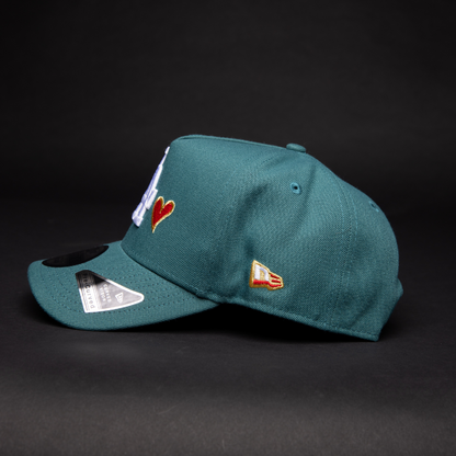 NEW ERA 9FIFTY A-FRAME PINE GREEN LOS ANGELES DODGERS SNAPBACK W/ RED HEART + 50TH ANNIVERSARY SIDE PATCH