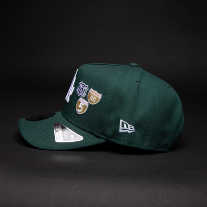 NEW ERA 9FIFTY A-FRAME FOREST GREEN LOS ANGELES DODGERS SNAPBACK W/ INTERSTATE + 50TH ANNIVERSARY SIDE PATCH
