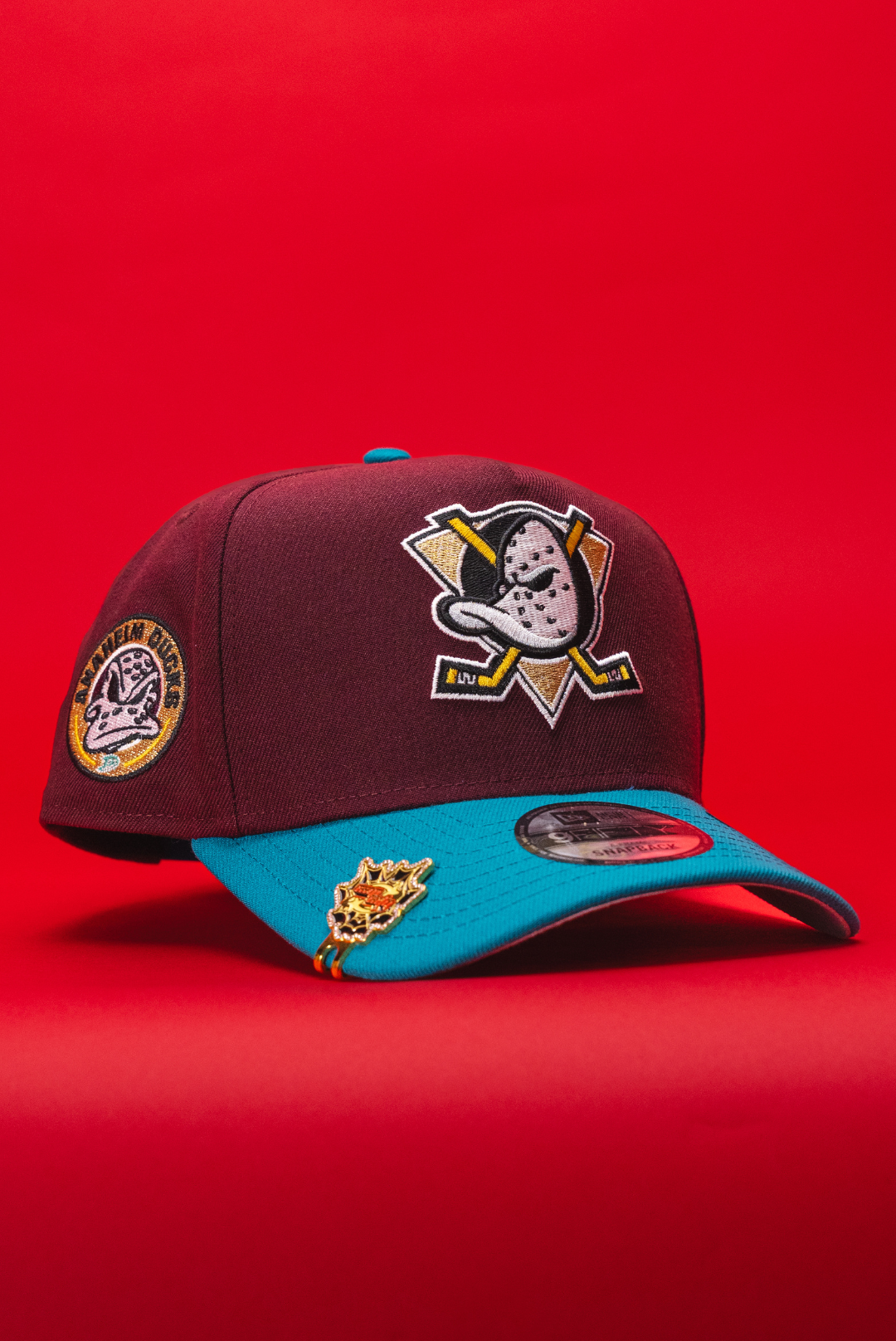 NEW ERA 9FIFTY A-FRAME BURGUNDY/TURQUOISE ANAHEIM DUCKS SNAPBACK W/ "DUCKS" SIDE PATCH