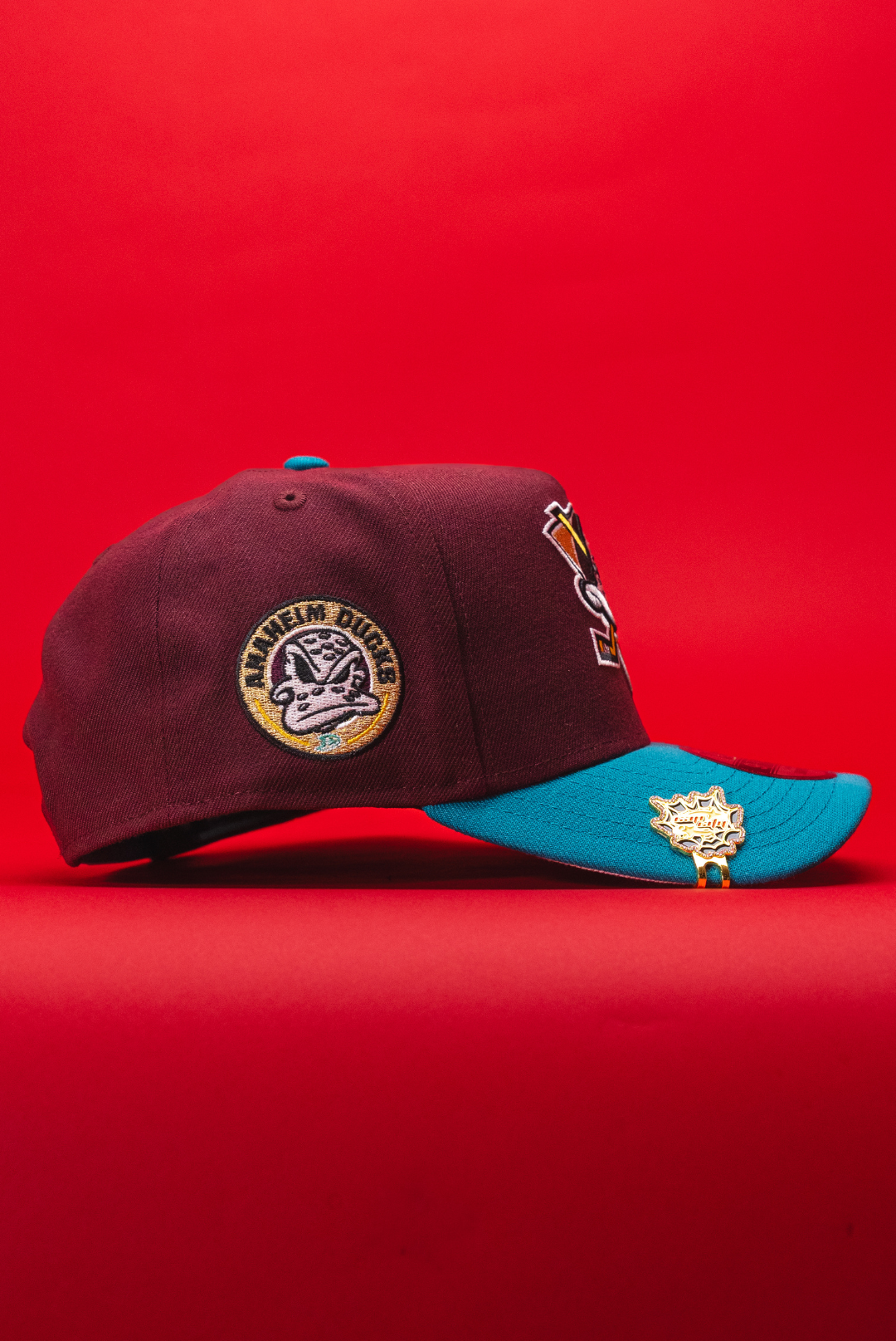 NEW ERA 9FIFTY A-FRAME BURGUNDY/TURQUOISE ANAHEIM DUCKS SNAPBACK W/ "DUCKS" SIDE PATCH