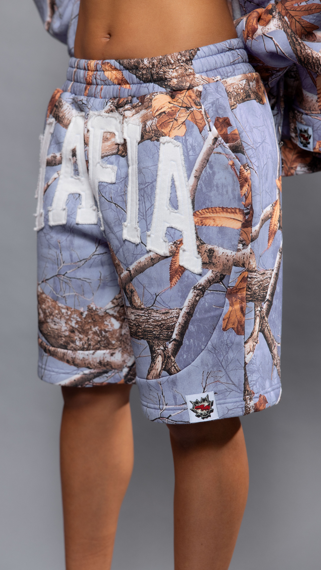 CAP CITY X SHORELINE MAFIA LAVENDER CAMO SHORTS - UNISEX