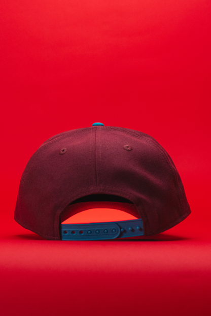 NEW ERA 9FIFTY A-FRAME BURGUNDY/TURQUOISE ANAHEIM DUCKS SNAPBACK W/ "DUCKS" SIDE PATCH