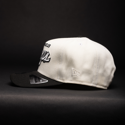 NEW ERA 9FIFTY A-FRAME CHROME/BLACK LOS ANGELES KINGS SCRIPT SNAPBACK W/ 25TH ANNIVERSARY SIDE PATCH