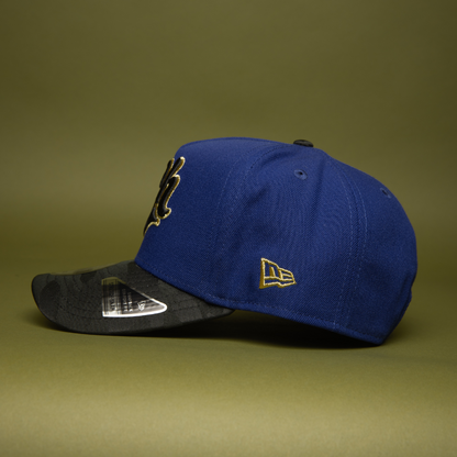 NEW ERA 9FIFTY A-FRAME DARK BLUE/BLACK CAMO CHARROS DE JALISCO SNAPBACK W/ MEXICO FLAG SIDE PATCH