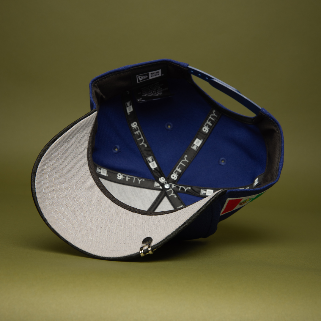 NEW ERA 9FIFTY A-FRAME DARK BLUE/BLACK CAMO CHARROS DE JALISCO SNAPBACK W/ MEXICO FLAG SIDE PATCH