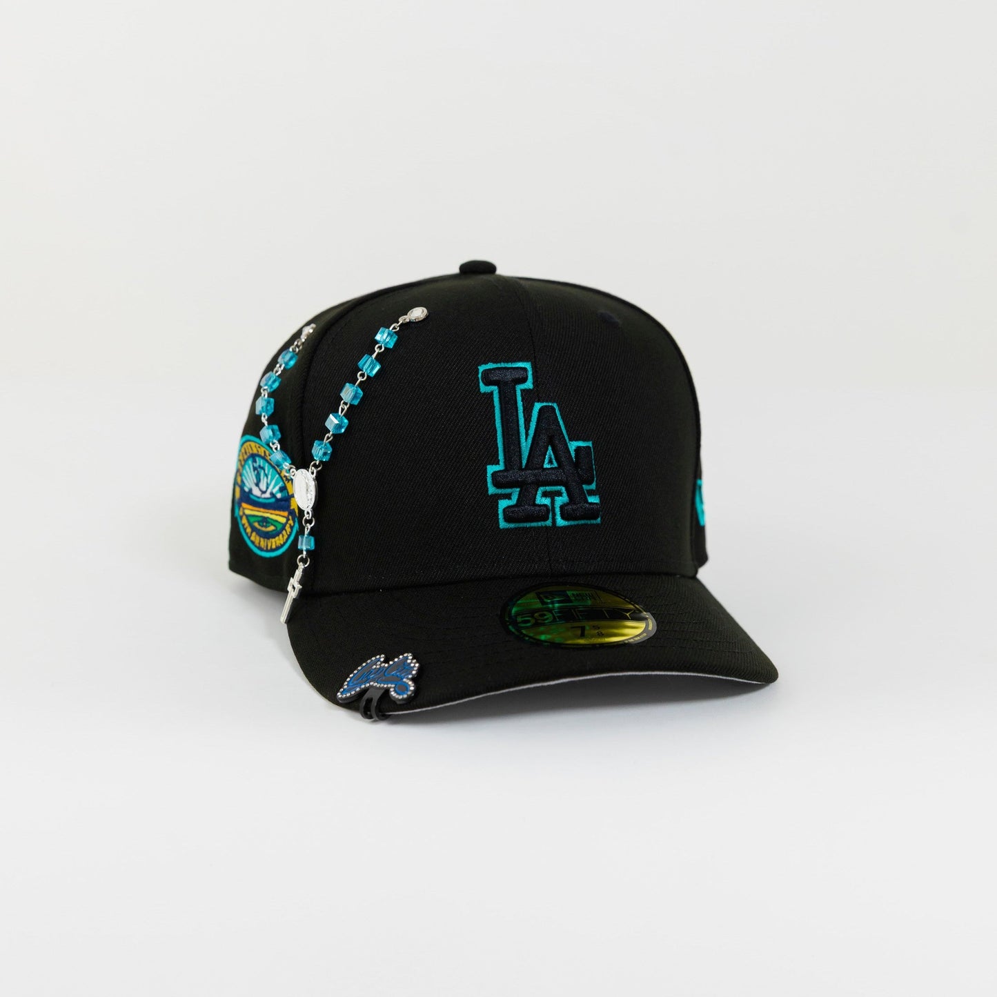 NEW ERA 59FIFTY BLACKED OUT LOS ANGELES DODGERS W/ TEAL OUTLINE + 50TH ANNIVERSARY SIDE PATCH