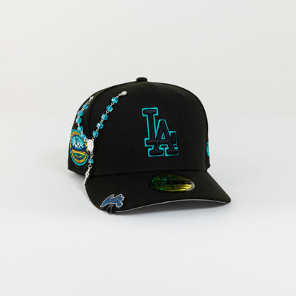 NEW ERA 59FIFTY BLACKED OUT LOS ANGELES DODGERS W/ TEAL OUTLINE + 50TH ANNIVERSARY SIDE PATCH