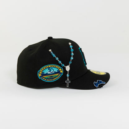 NEW ERA 59FIFTY BLACKED OUT LOS ANGELES DODGERS W/ TEAL OUTLINE + 50TH ANNIVERSARY SIDE PATCH