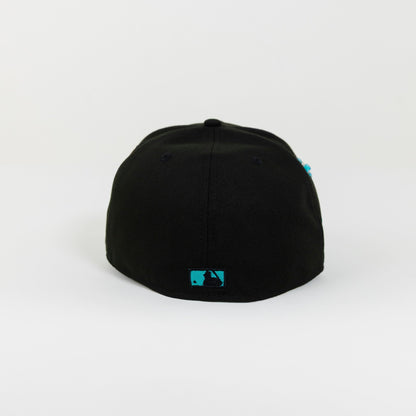 NEW ERA 59FIFTY BLACKED OUT LOS ANGELES DODGERS W/ TEAL OUTLINE + 50TH ANNIVERSARY SIDE PATCH