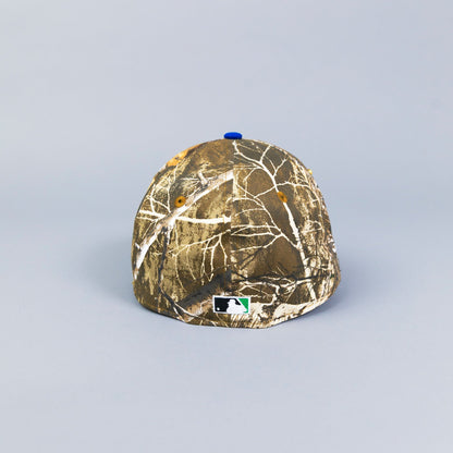 NEW ERA 59FIFTY REALTREE/ BLUE UPSIDE DOWN LOS ANGELES DODGERS W/ 40TH ANNIVERSARY SIDE PATCH