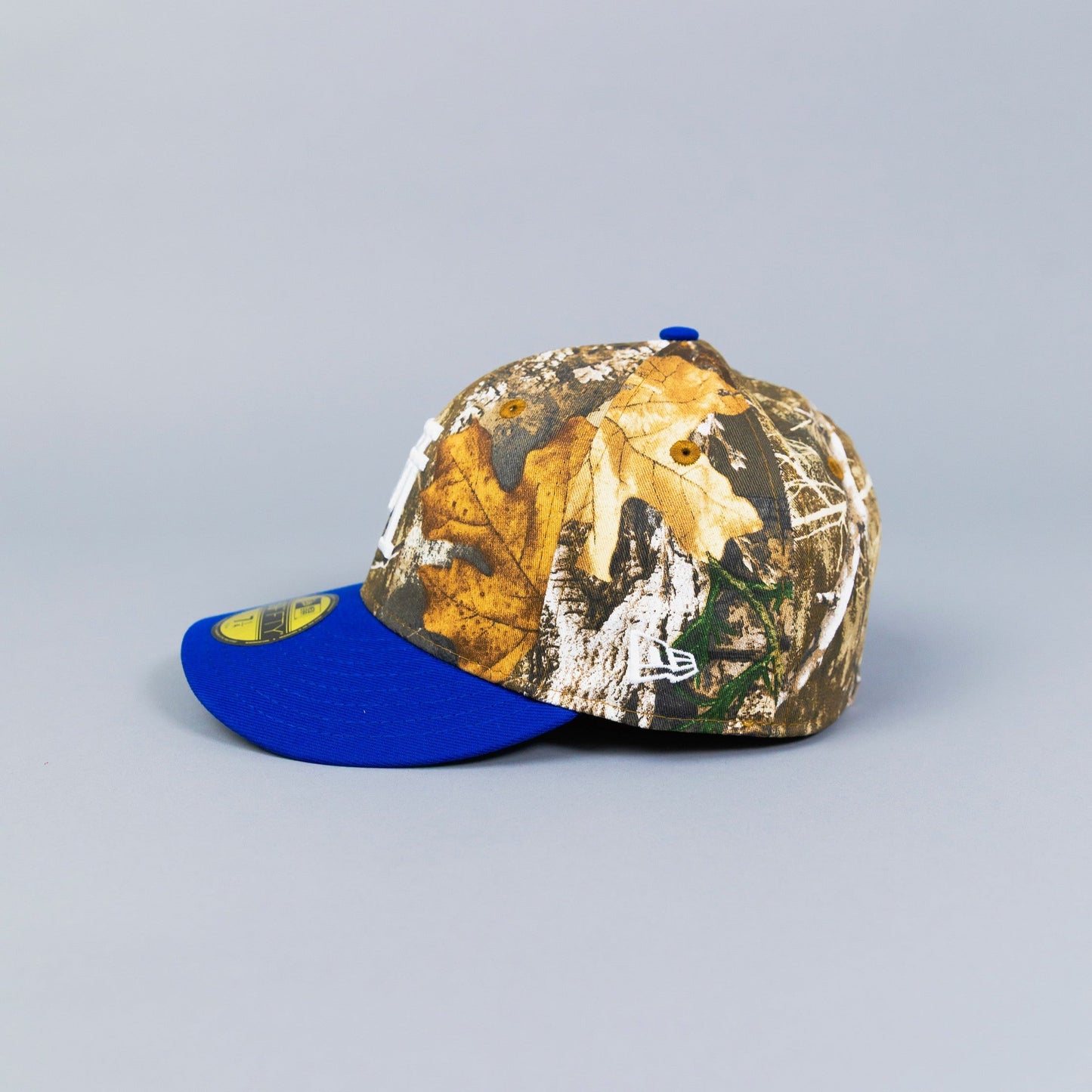 NEW ERA 59FIFTY REALTREE/ BLUE UPSIDE DOWN LOS ANGELES DODGERS W/ 40TH ANNIVERSARY SIDE PATCH
