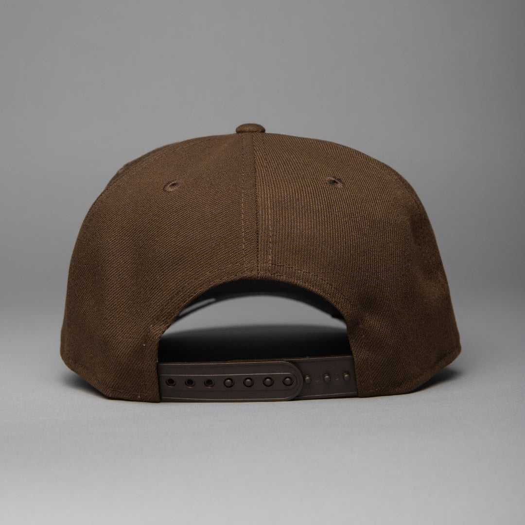 NEW ERA 9FIFTY A-FRAME BROWN/BLACK BALTIMORE ORIOLES SNAPBACK W/ 50TH ANNIVERSARY SIDE PATCH