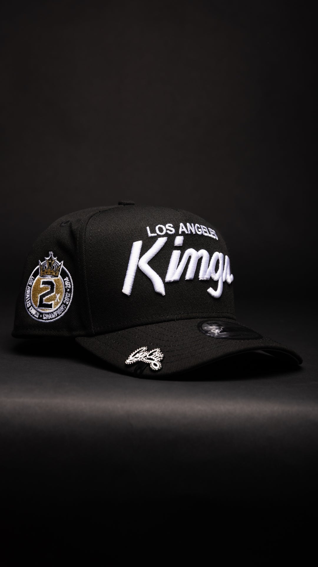 NEW ERA 9FIFTY A-FRAME BLACK LOS ANGELES KINGS SCRIPT SNAPBACK W/ 2012 NHL CHAMPIONS SIDE PATCH