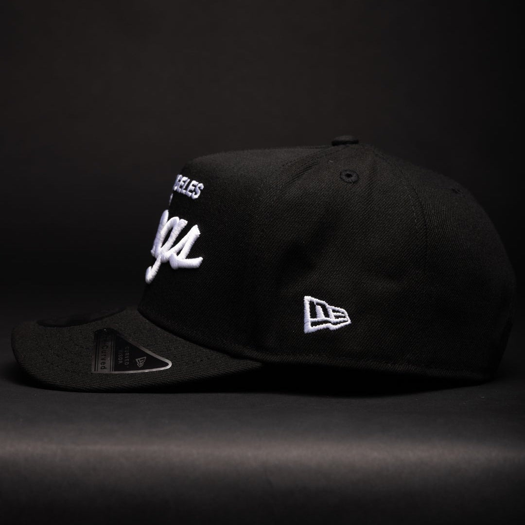 NEW ERA 9FIFTY A-FRAME BLACK LOS ANGELES KINGS SCRIPT SNAPBACK W/ 2012 NHL CHAMPIONS SIDE PATCH