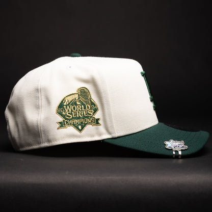 NEW ERA 9FIFTY A-FRAME CHROME/FOREST GREEN LOS ANGELES DODGERS SNAPBACK W/ WORLD SERIES CHAMPIONS SIDE PATCH