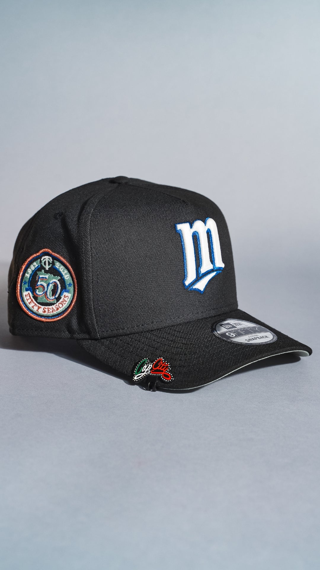 NEW ERA 9FIFTY A-FRAME BLACK MINNESOTA TWINS SNAPBACK W/ 50TH ANNIVERSARY SIDE PATCH