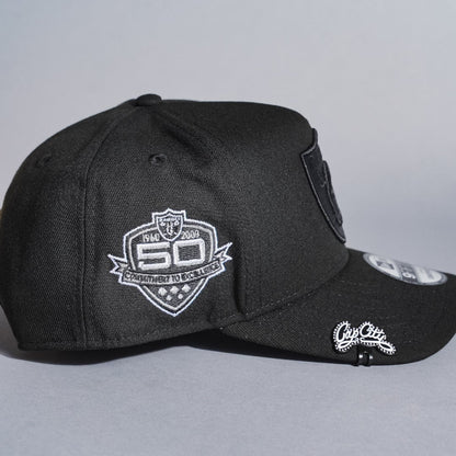 NEW ERA 9FIFTY A-FRAME BLACKED OUT LAS VEGAS RAIDERS SNAPBACK W/ 50TH ANNIVERSARY SIDE PATCH