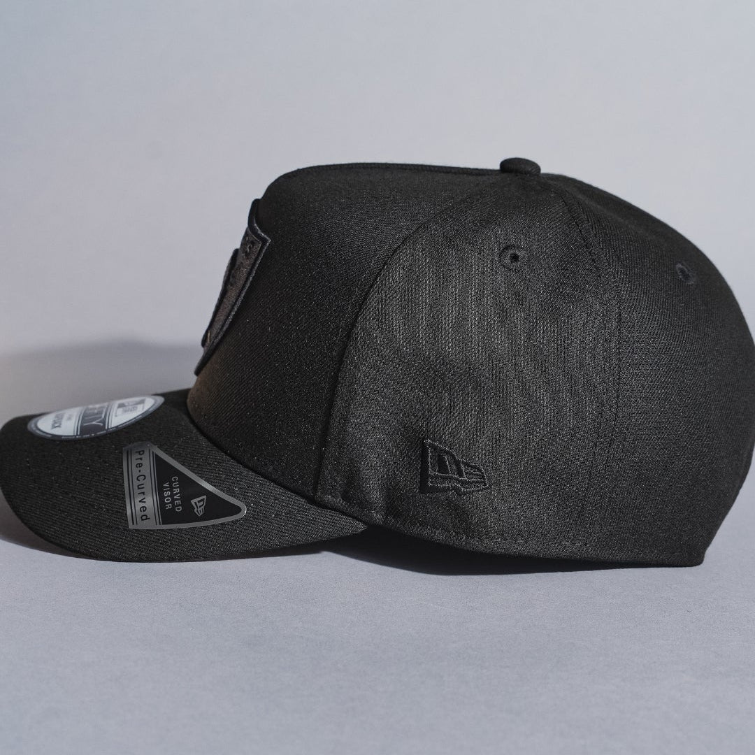 NEW ERA 9FIFTY A-FRAME BLACKED OUT LAS VEGAS RAIDERS SNAPBACK W/ 50TH ANNIVERSARY SIDE PATCH