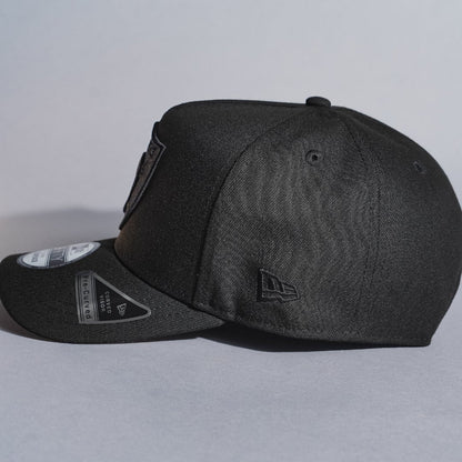 NEW ERA 9FIFTY A-FRAME BLACKED OUT LAS VEGAS RAIDERS SNAPBACK W/ 50TH ANNIVERSARY SIDE PATCH