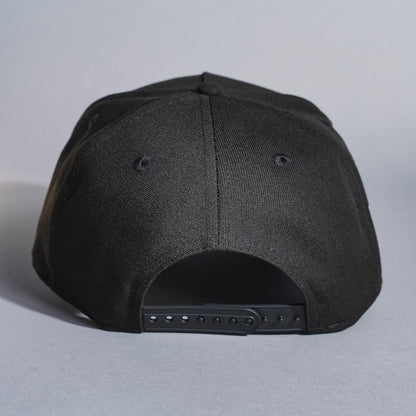 NEW ERA 9FIFTY A-FRAME BLACKED OUT LAS VEGAS RAIDERS SNAPBACK W/ 50TH ANNIVERSARY SIDE PATCH