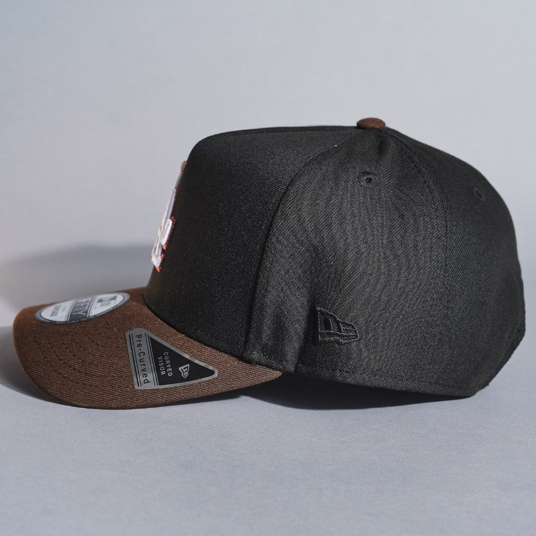NEW ERA 9FIFTY A-FRAME BLACK/BROWN LOS ANGELES DODGERS SNAPBACK W/ WORLD SERIES CHAMPIONS SIDE PATCH