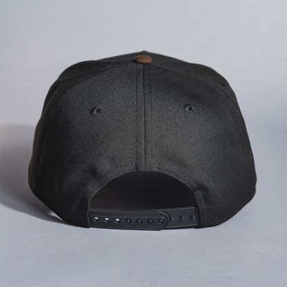 NEW ERA 9FIFTY A-FRAME BLACK/BROWN UPSIDE DOWN ANAHEIM ANGELS SNAPBACK W/ 50TH ANNIVERSARY SIDE PATCH
