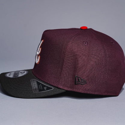 NEW ERA 9FIFTY A-FRAME BURGUNDY/BLACK ATLANTA BRAVES SNAPBACK W/ 1999 WORLD SERIES SIDE PATCH