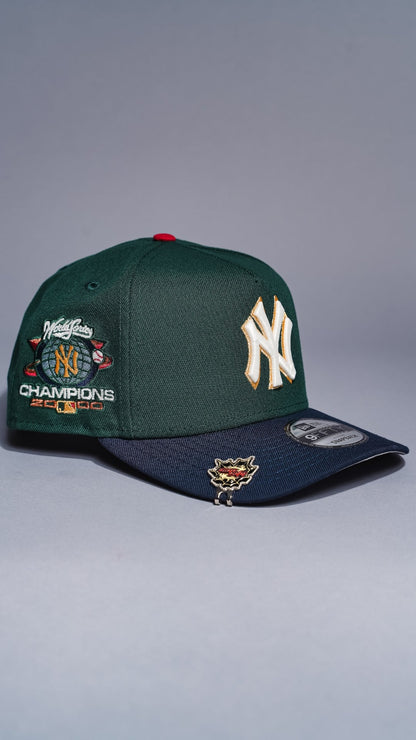 NEW ERA 9FIFTY A-FRAME FOREST GREEN/NAVY NEW YORK YANKEES SNAPBACK W/ WORLD SERIES CHAMPIONS SIDE PATCH