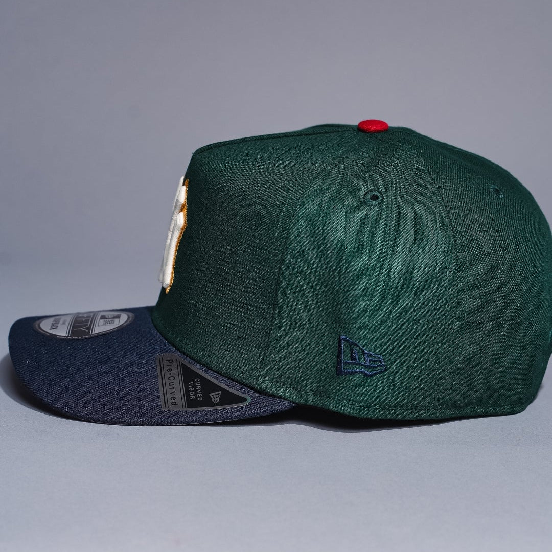 NEW ERA 9FIFTY A-FRAME FOREST GREEN/NAVY NEW YORK YANKEES SNAPBACK W/ WORLD SERIES CHAMPIONS SIDE PATCH