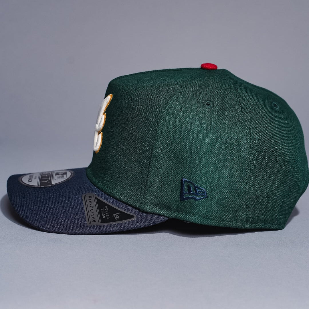NEW ERA 9FIFTY A-FRAME FOREST GREEN/NAVY ATLANTA BRAVES SNAPBACK W/ ANNIVERSARY SIDE PATCH