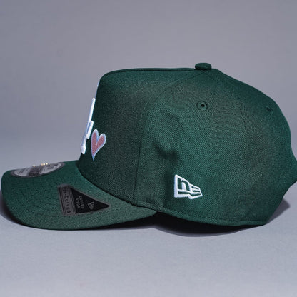 NEW ERA 9FIFTY A-FRAME FOREST GREEN LOS ANGELES DODGERS SNAPBACK W/ HEART + WORLD SERIES CHAMPIONS SIDE PATCH