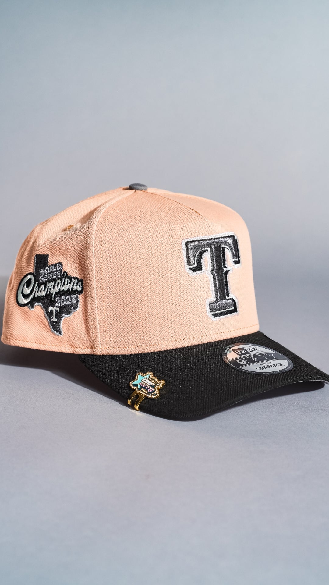 NEW ERA 9FIFTY A-FRAME BLUSH/BLACK TEXAS RANGERS SNAPBACK W/ WORLD SERIES CHAMPIONS SIDE PATCH