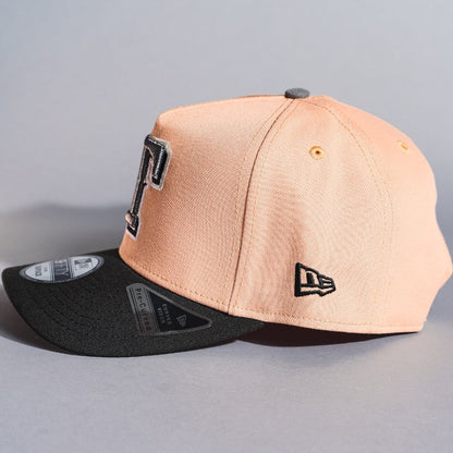 NEW ERA 9FIFTY A-FRAME BLUSH/BLACK TEXAS RANGERS SNAPBACK W/ WORLD SERIES CHAMPIONS SIDE PATCH