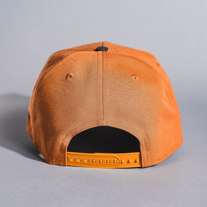 NEW ERA 9FIFTY A-FRAME TAN/BLACK ATLANTA BRAVES SNAPBACK W/ 1995 WORLD SERIES SIDE PATCH