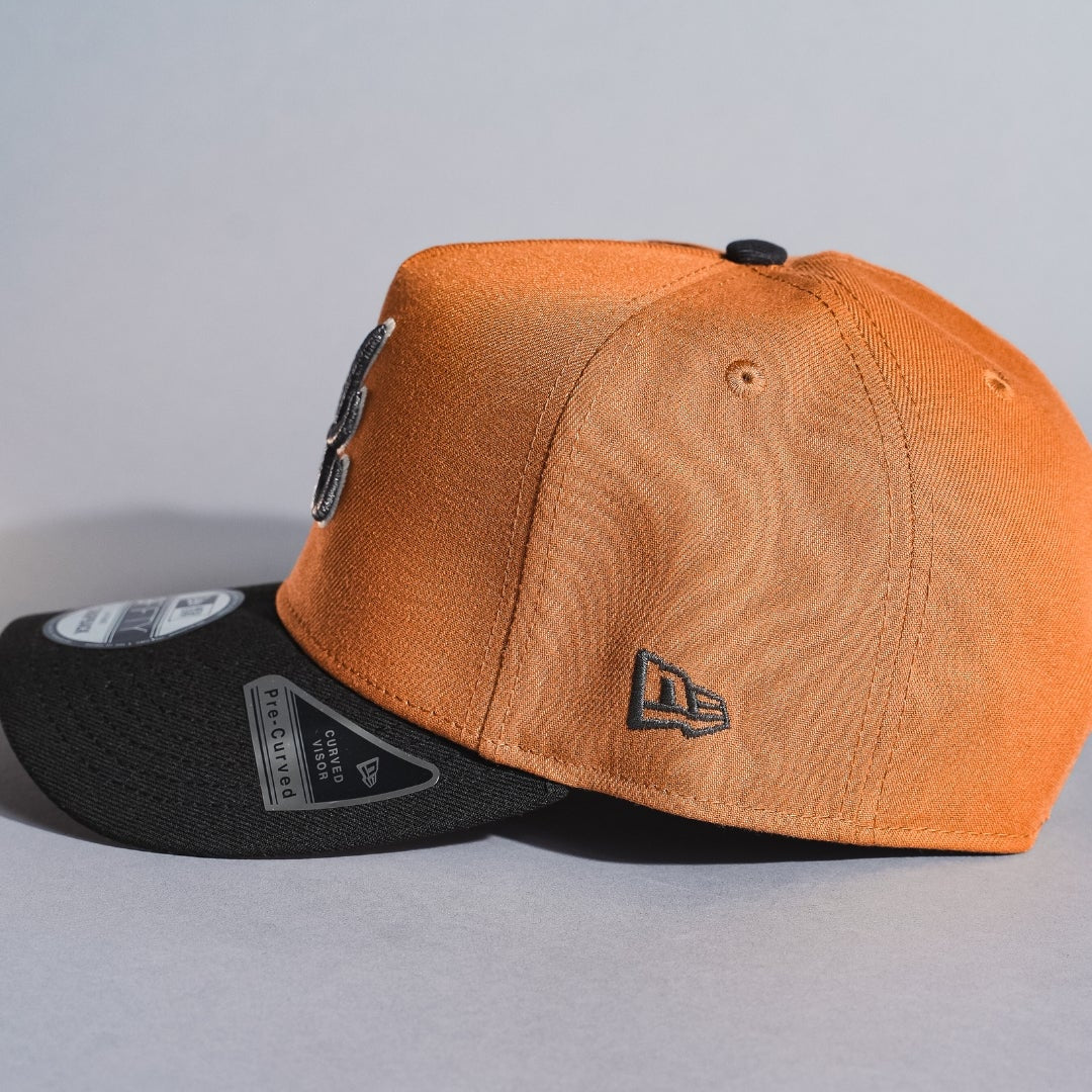 NEW ERA 9FIFTY A-FRAME TAN/BLACK ATLANTA BRAVES SNAPBACK W/ 1995 WORLD SERIES SIDE PATCH