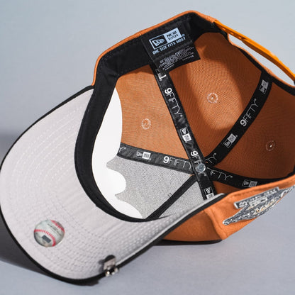 NEW ERA 9FIFTY A-FRAME TAN/BLACK ATLANTA BRAVES SNAPBACK W/ 1995 WORLD SERIES SIDE PATCH