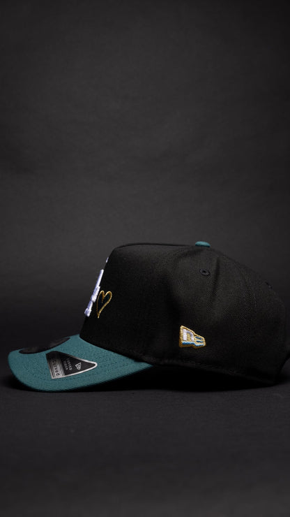 NEW ERA 9FIFTY A-FRAME BLACK/PINE GREEN LOS ANGELES DODGERS SNAPBACK W/ HEART + 40TH ANNIVERSARY SIDE PATCH