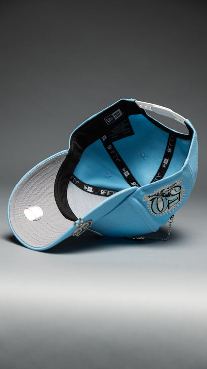 NEW ERA EXCLUSIVE 9FIFTY ICY BLUE BALTIMORE ORIOLES SNAPBACK W/ 50TH ANNIVERSARY SIDE PATCH