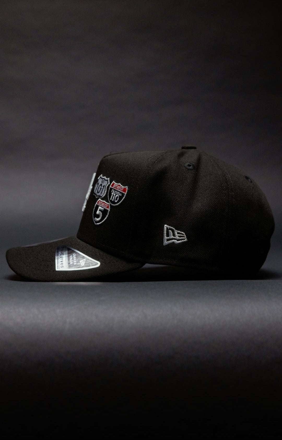 NEW ERA 9FIFTY A-FRAME BLACK LOS ANGELES DODGERS SNAPBACK W/ INTERSTATE + 50TH ANNIVERSARY SIDE PATCH