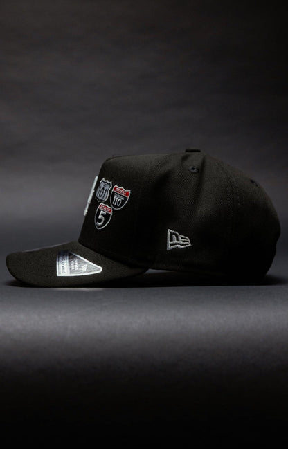 NEW ERA 9FIFTY A-FRAME BLACK LOS ANGELES DODGERS SNAPBACK W/ INTERSTATE + 50TH ANNIVERSARY SIDE PATCH