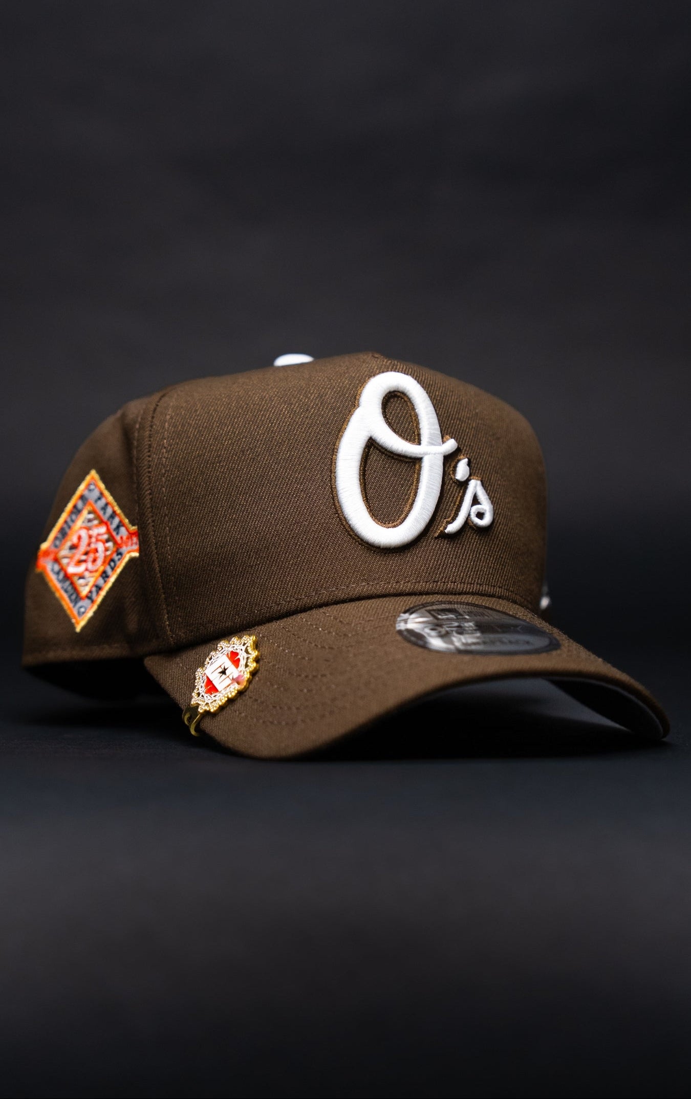 NEW ERA 9FIFTY A-FRAME BROWN BALTIMORE ORIOLES SNAPBACK W/ 25TH ANNIVERSARY SIDE PATCH