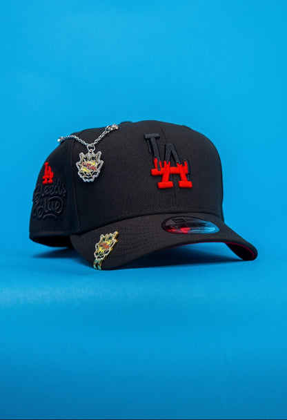 NEW ERA EXCLUSIVE 9FIFTY BLACK LOS ANGELES DODGERS SNAPBACK W/ "LA BLEEDS BLUE" SIDE PATCH