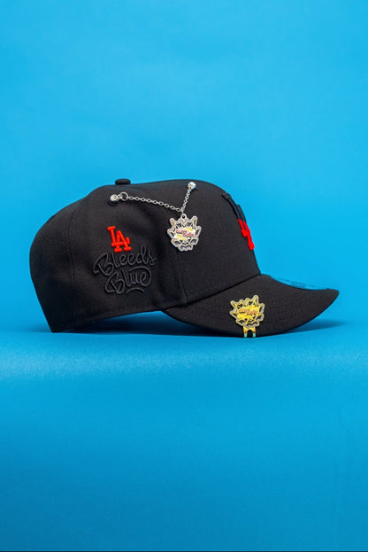 NEW ERA EXCLUSIVE 9FIFTY BLACK LOS ANGELES DODGERS SNAPBACK W/ "LA BLEEDS BLUE" SIDE PATCH