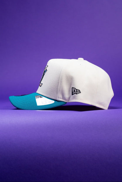 NEW ERA 9FIFTY A-FRAME CHROME/TURQUOISE ANAHEIM DUCKS SNAPBACK W/ "DUCKS" SIDE PATCH